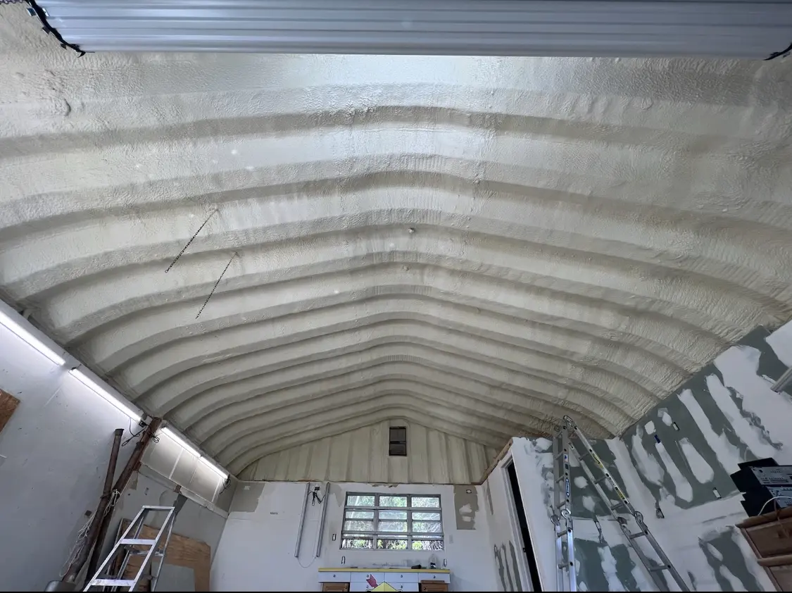 Spray polyurethane foam applied to the underside of a metal roof deck in Parker